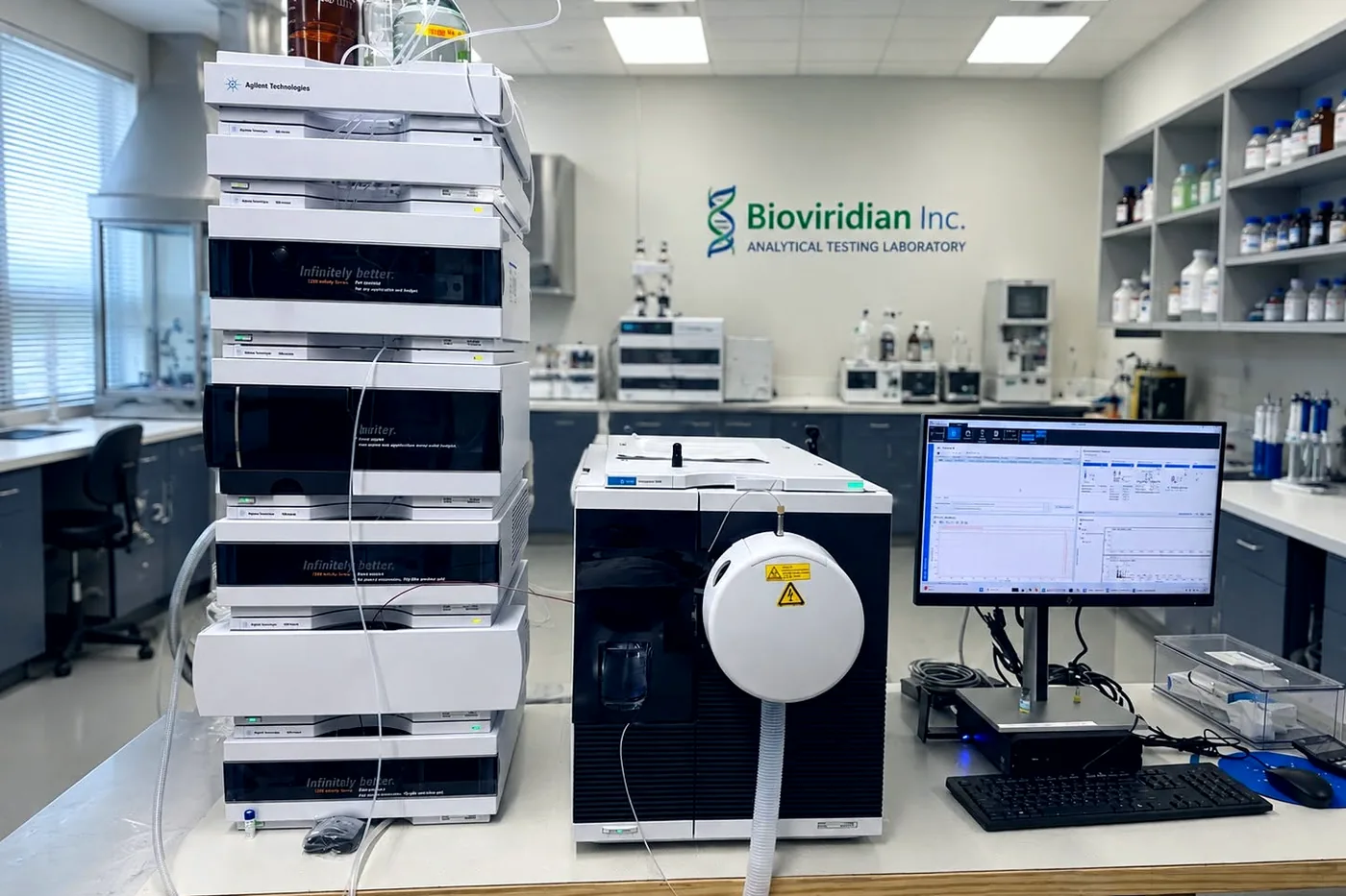 The analytical laboratory at Bioviridian Inc., with chromatography instruments on the bench and the company's sign on the wall.
